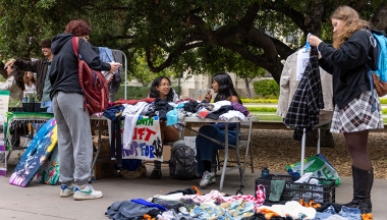 Occidental College students on the quad looking through donated reusable goods
