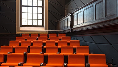 Orange seats on the inside of Choi theater