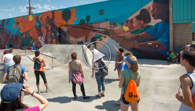 Students view mural at the Museum of Social Justice