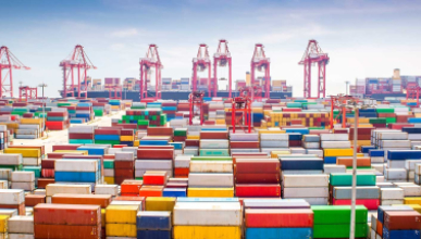  A busy maritime container port with multicolored cargo containers
