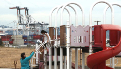 A child and adult at a playground