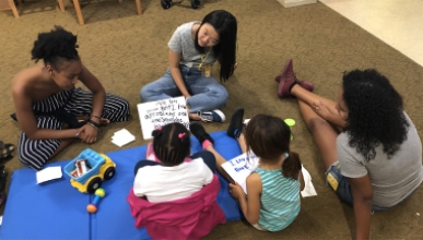 Oxy students volunteering with children
