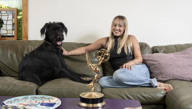Two-time Emmy winner Emma Choate ’20 with her 2-year-old dog, George.