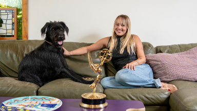 Two-time Emmy winner Emma Choate ’20 with her 2-year-old Irish wolfhound, George.