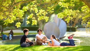 Occidental students relax near Lucille Gilman Fountain on an idyllic fall afternoon.