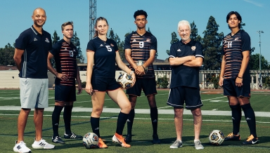 Oxy soccer players posing on field