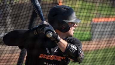 An Oxy baseball player takes batting practice on January 27, 2022.