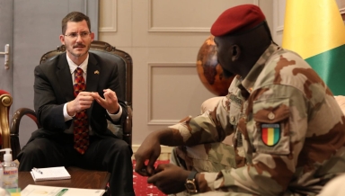 Michael Gonzales '96 with Guinean Transition President Mamady Doumbouya.