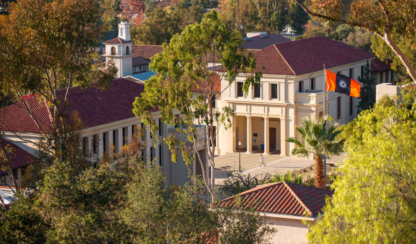 View of Johnson Hall, the Johnson Student Center bell tower and the Occidental College flag. 