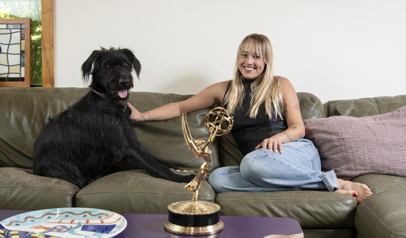 Two-time Emmy winner Emma Choate ’20 with her 2-year-old dog, George.
