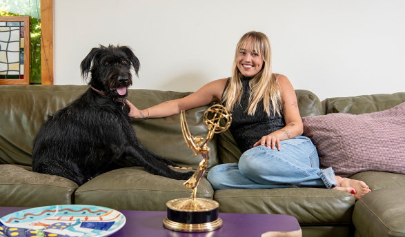 Two-time Emmy winner Emma Choate ’20 with her 2-year-old Irish wolfhound, George.
