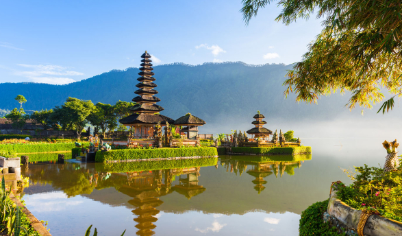 A historical building next to a river in Indonesia