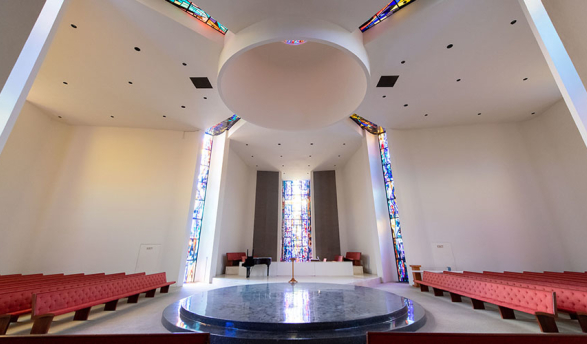 The interior of Herrick chapel showing a central opening and stained glass