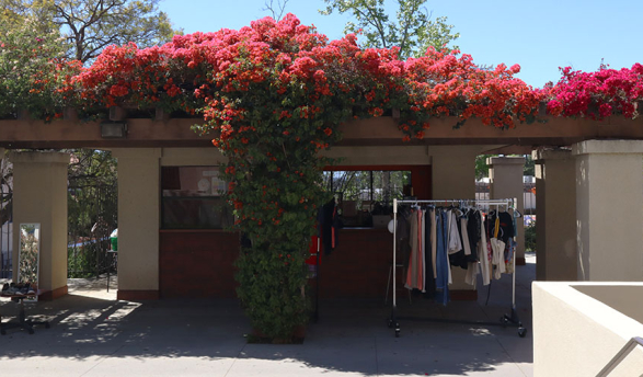 The Concession Stand on the Occidental College campus, now Touchdown thirft store with a rack of clothing out front