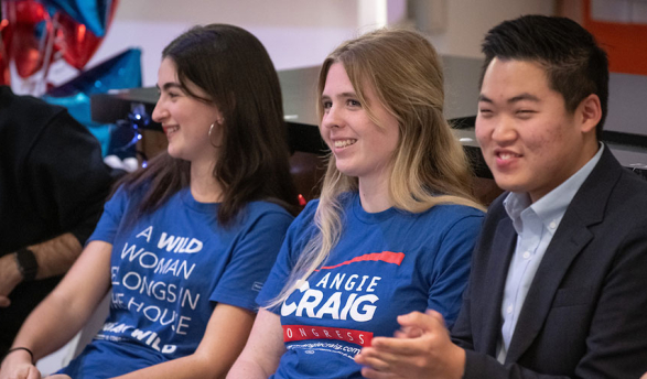 three Oxy student panel participants sit together smiling