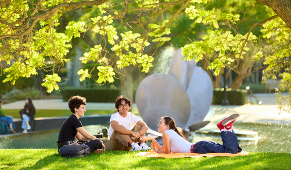 Occidental students relax near Lucille Gilman Fountain on an idyllic fall afternoon.