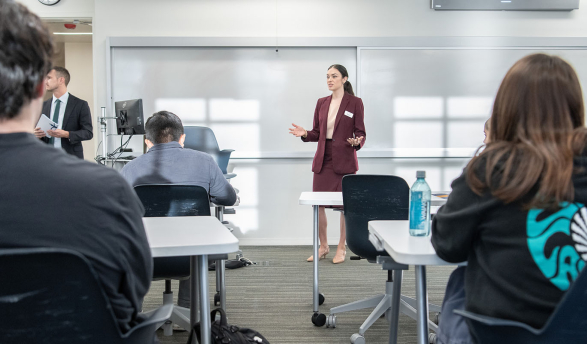 Occidental College professor Marisol Leon standing in front of a classroom of students, talking