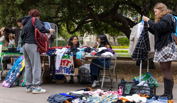 Occidental College students on the quad looking through donated reusable goods