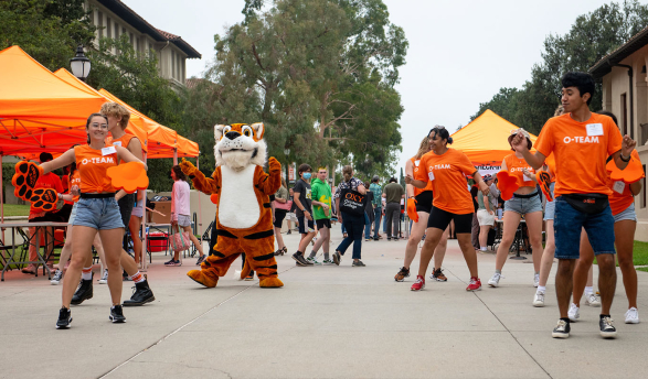 Oswald on the Quad with O-Team Members dancing