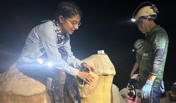 Assistant Professor Natasha Sekhon studies broken stalagmites to decide whether they should be brought back to the U.S. for further research. 