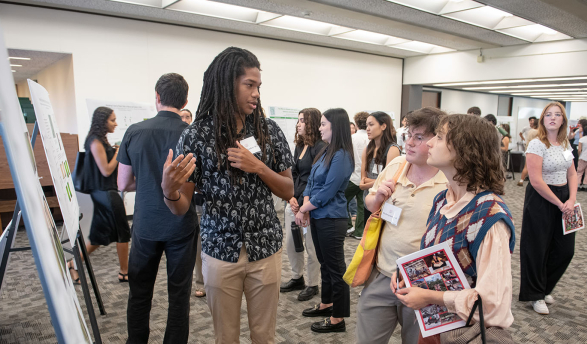 an Occidental College student presenting his undergraduate research project