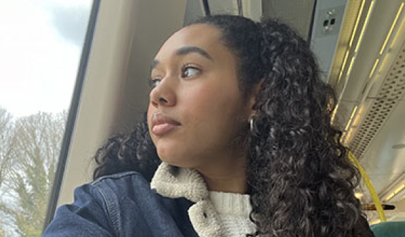 a young woman looking out of a bus window