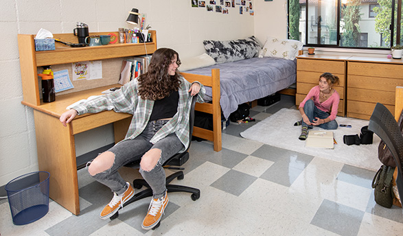Roommates talk in the residence hall at Occidental College