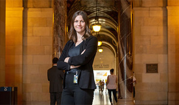 Student stands in hallway of Los Angeles Mayors Office