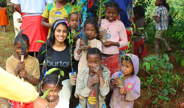 Oxy student with children in Africa