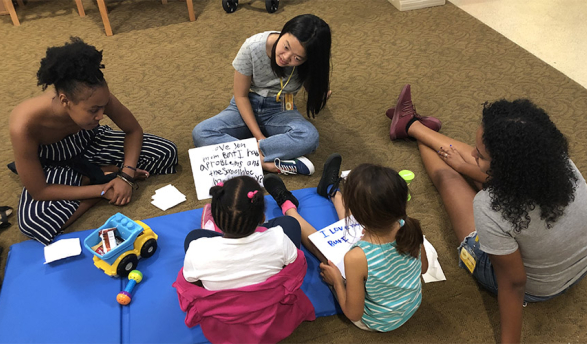 Oxy students volunteering with children