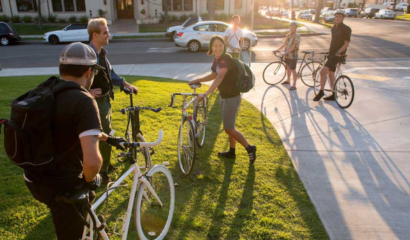 Oxy students on campus with their bikes