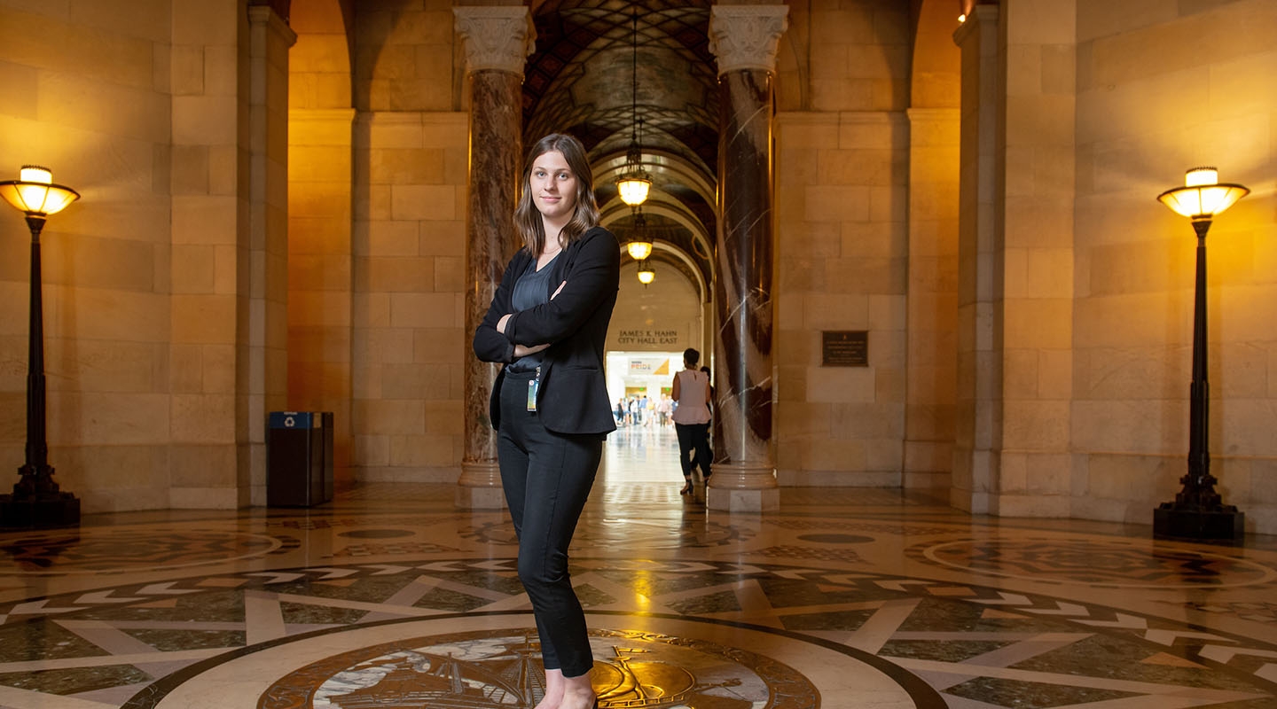 student standing in the lobby of city hall in LA
