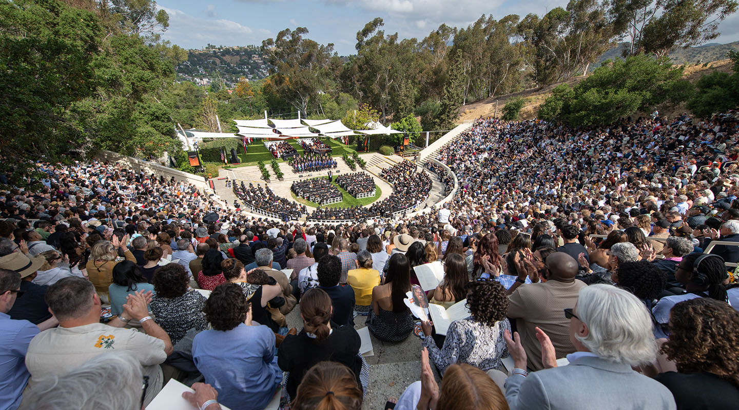 A crowd full of people sititng in the Remsen Bird Hillside Theater at Commencement in 2025