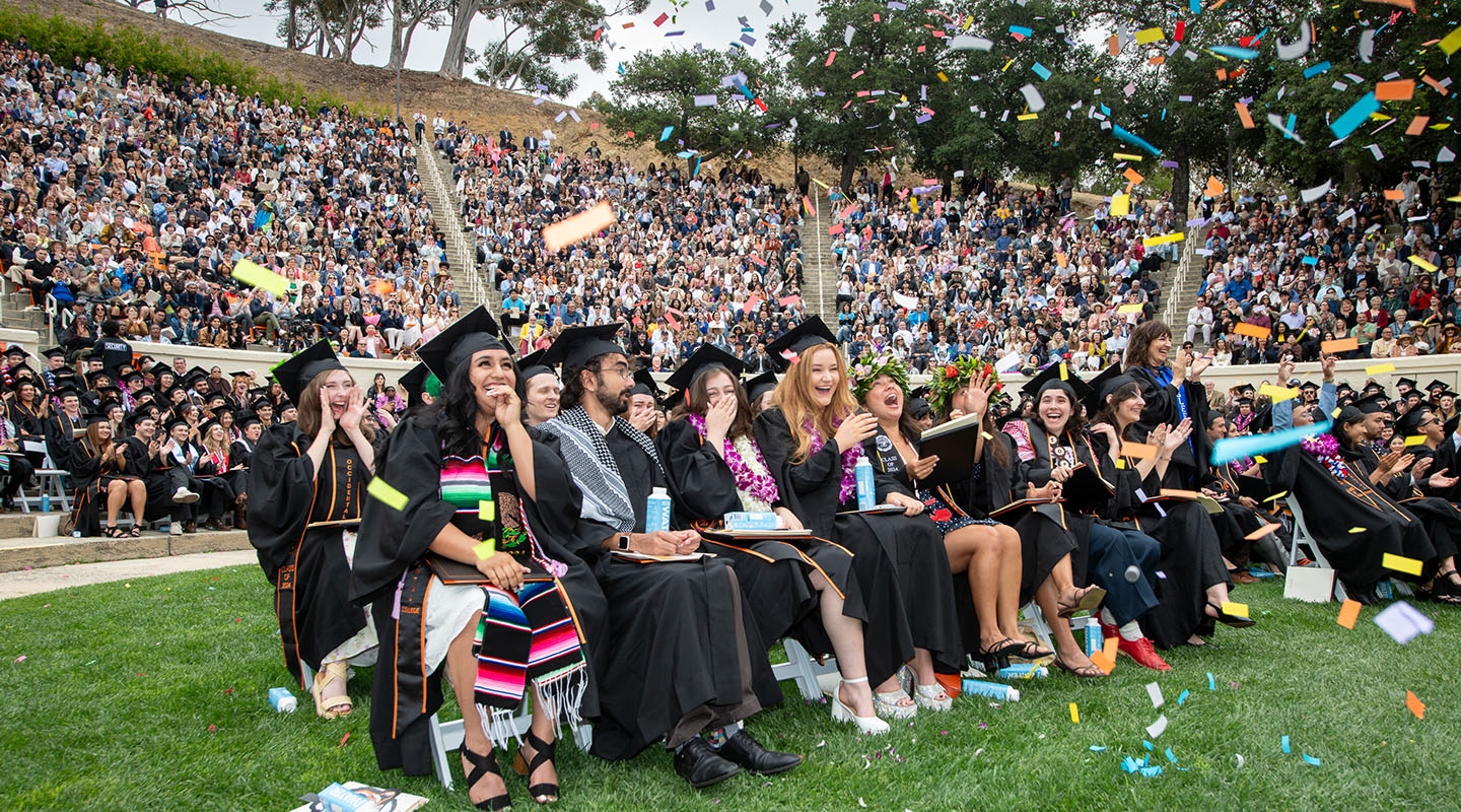 Occidental College graduates on graduation day celebrating in their seats