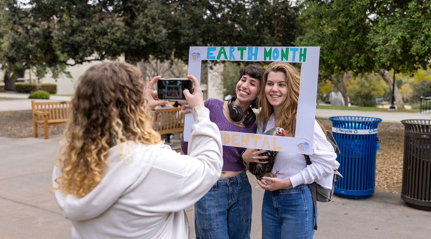 Occidental College students posing in the Quad during an Earth Month event