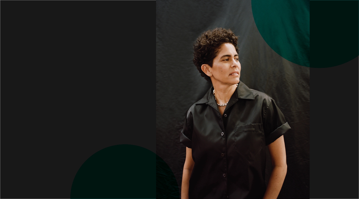 Julie Mehretu in a black shorts sleeve button up shirt