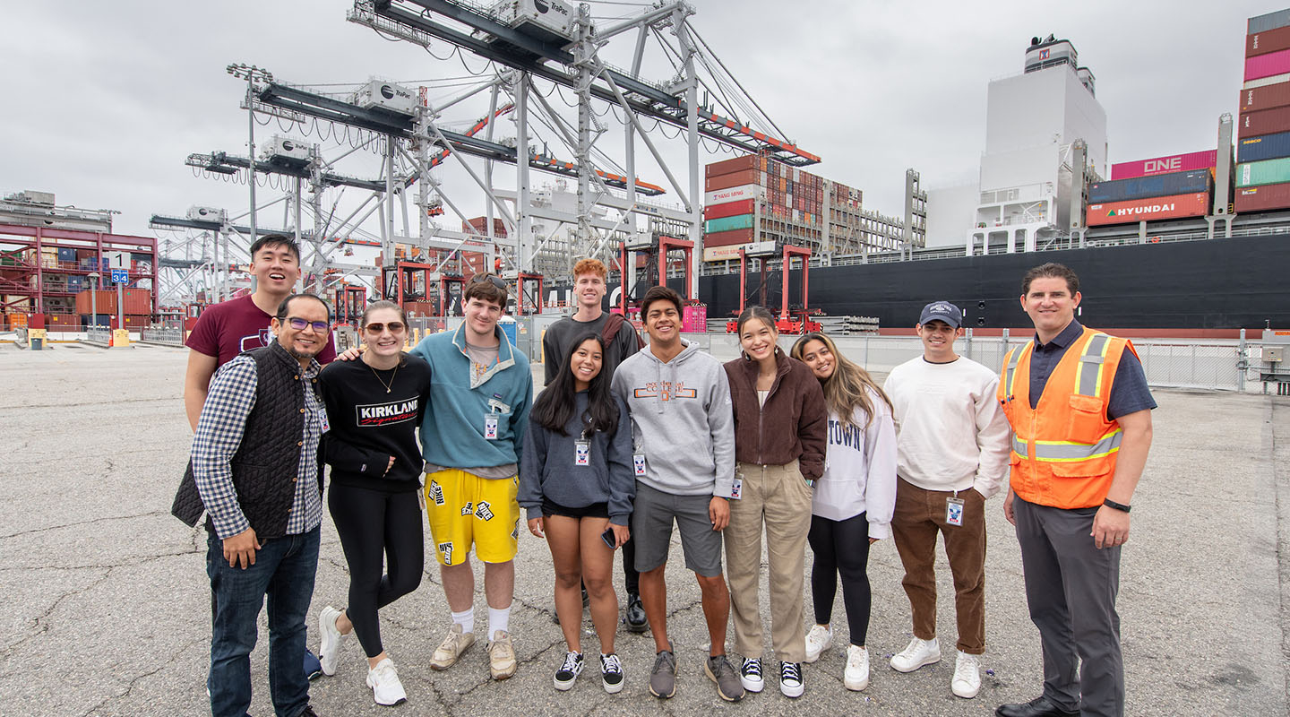 a group of Occidental College students on a field trip with their professor at the Port of Los Angeles