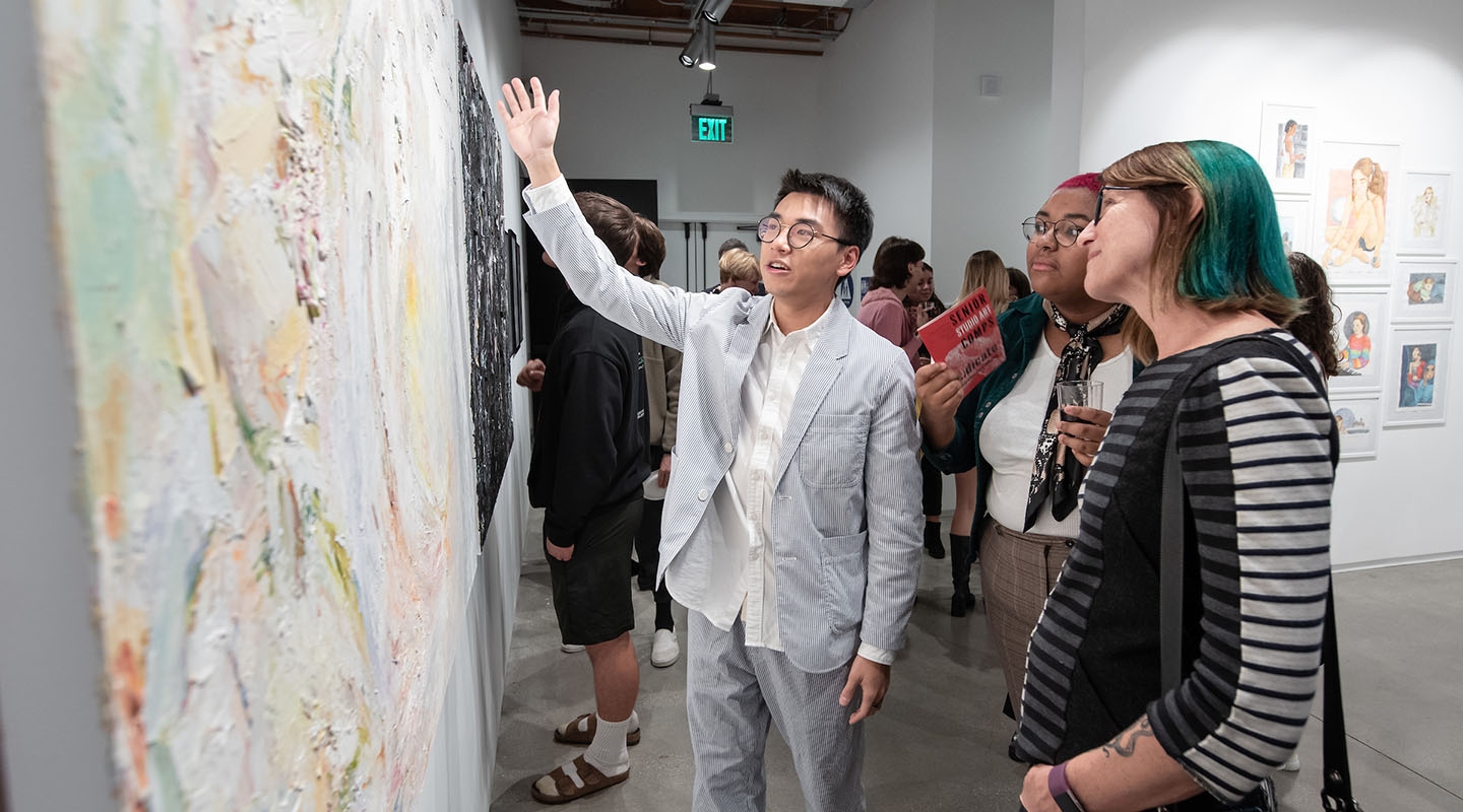 a senior Oxy student shows off his senior comps studio art project in Los Angeles