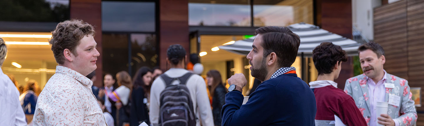 Occidental College students and alumni networking at an event in front of the Hameetman Career Center on campus