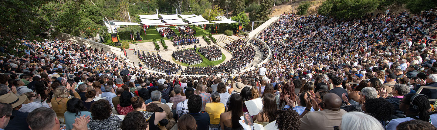 A crowd full of people sititng in the Remsen Bird Hillside Theater at Commencement in 2025