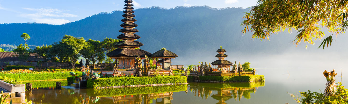 A historical building next to a river in Indonesia