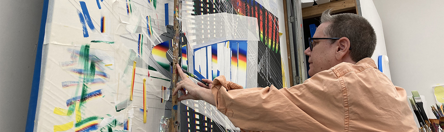 Professor Linda Besemer, working with a straight edge on a lift at their studio in 2022.