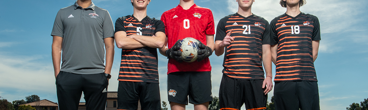 Coach Rod Lafaurie and members of the 2023 men's soccer team