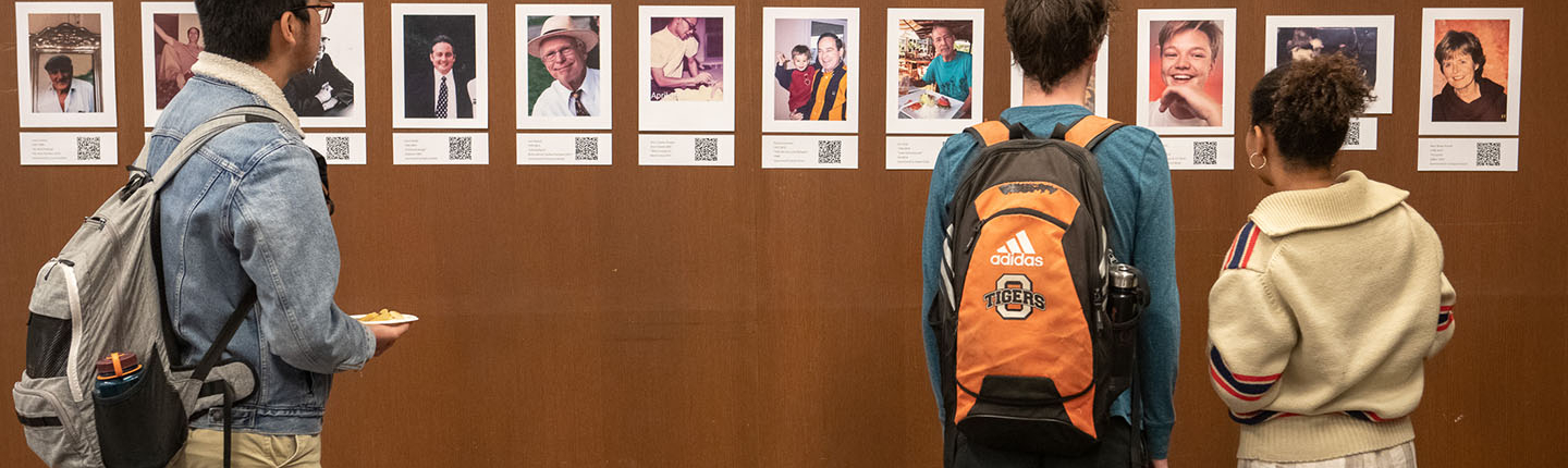 Students looking at an interactive exhibit in the Oxy library