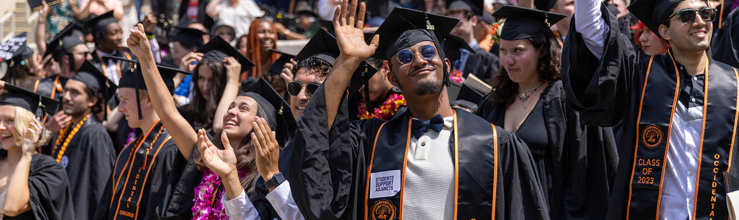 A scene on commencement day with a big crowd of happy graduates