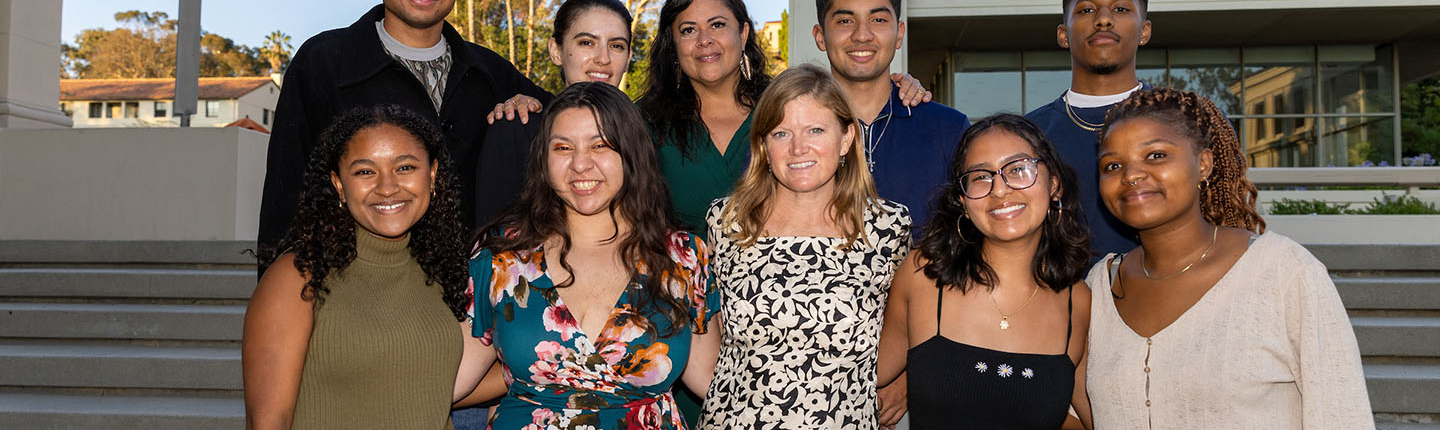 8 Obama Scholars pose with Maya Soetero-Ng on the steps of AGC