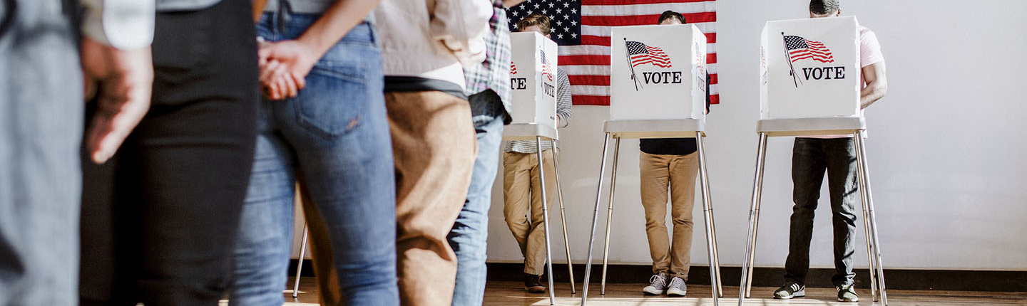 Citizens participating in a United States election by casting their votes at a polling place