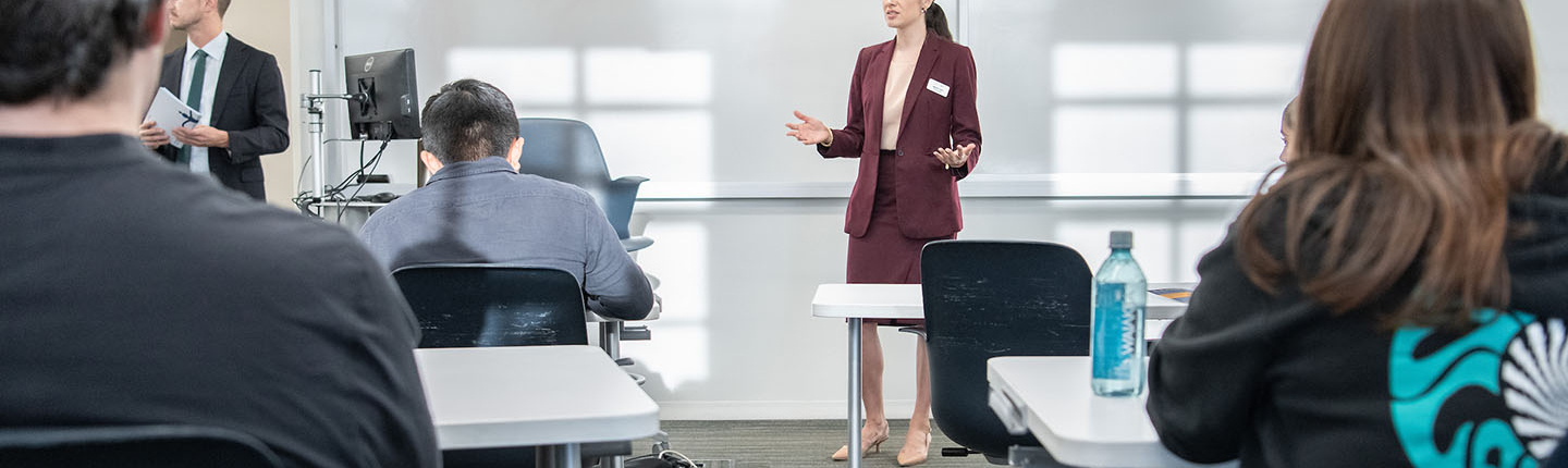 Occidental College professor Marisol Leon standing in front of a classroom of students, talking