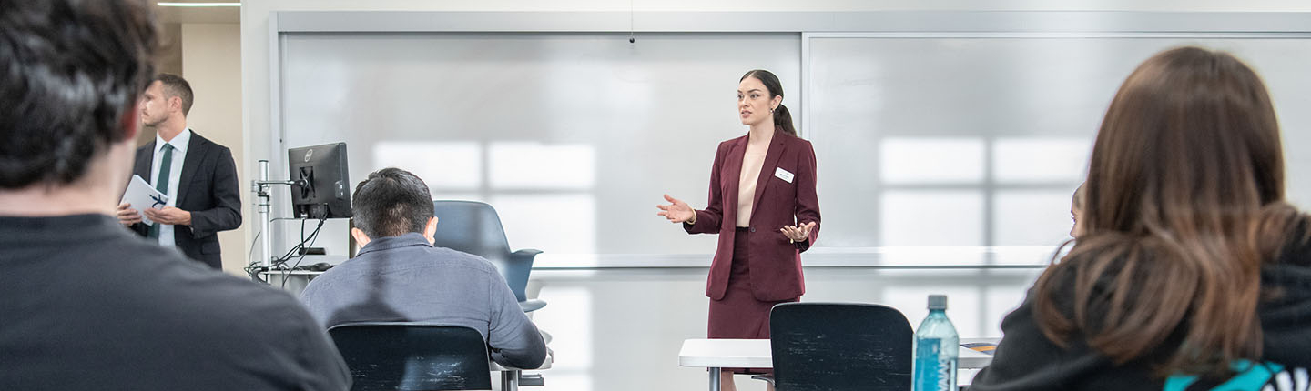 Occidental College professor Marisol Leon standing in front of a classroom of students, talking