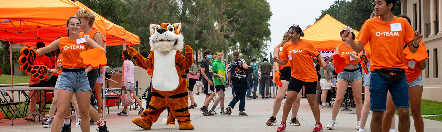 Oswald on the Quad with O-Team Members dancing